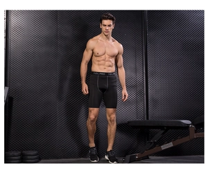 Close-up of black compression shorts featuring elastic waistband with Y-E-L PRO lettering