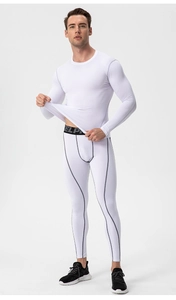 Detail of white compression suit with contrast black stitching and elastic waistband
