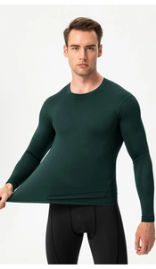 Close-up of high-elasticity dark green men's compression shirt showing muscle contours