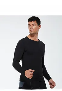 Close-up of men's black compression long sleeve shirt with elastic dry-fit fabric texture
