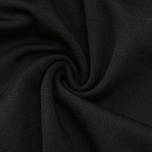 Detailed macro view of black stretch knit fabric with breathable vertical texture