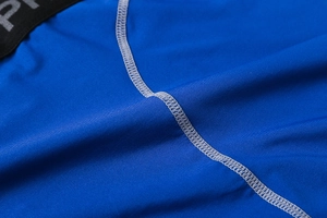 Detail of blue compression shorts showing flatlock stitching and elastic PRO waistband
