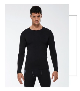 Close-up of black men's compression long sleeve shirt showing fabric texture and athletic fit