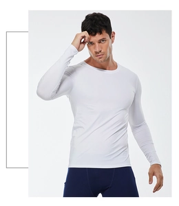 Detail of white long-sleeved compression shirt showing elastic breathable fabric fit