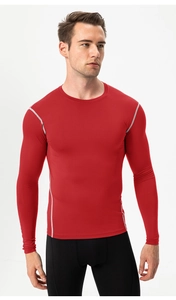 Men's red compression sports shirt with grey contrast stitching and crew neck detail