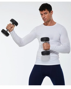 Close-up of athletic fit white long sleeve shirt showing stretch fabric and muscle contour