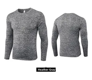 Detail view of heather grey long sleeve compression shirt with smooth athletic texture