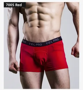Detail of red men's athletic boxer briefs with high-elastic fabric and logo waistband