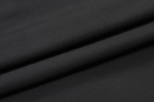 Close-up detail of high-elastic black moisture-wicking fabric with breathable texture