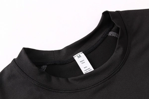 Close-up of men's compression shirt collar with M size tag and fabric composition details