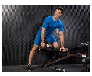 Detail of bright blue compression shorts with hexagonal texture for men's fitness training