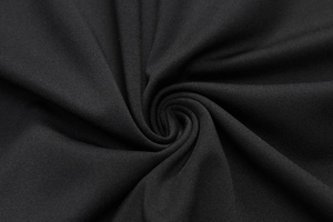 Macro detail of black high-elastic compression fabric with breathable mesh texture