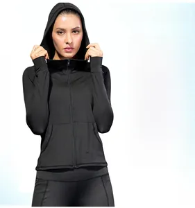 Close-up of slim-fit black yoga hoodie featuring full zipper and high-stretch fabric