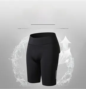Detail of breathable polyester high-waist yoga shorts with side reflective stripes