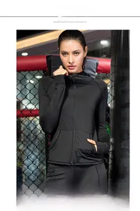 Women's black thermal yoga hoodie with high collar zip closure for winter running