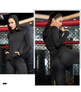 Detail showing women's black slim fit hooded sports jacket for yoga and gym workouts