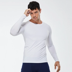 Men's white long sleeve compression shirt for pro fitness and running with elastic fabric
