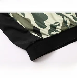 Detailed macro view of camo pattern yoga leggings with black elastic slimming waistband
