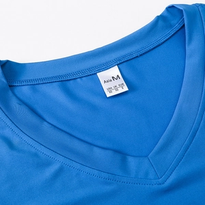 Detailed macro view of blue V-neck sports shirt collar with precise stitching and size label