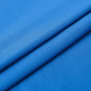 Close-up of premium dark blue fabric showing high-density rib texture for fitness shirts