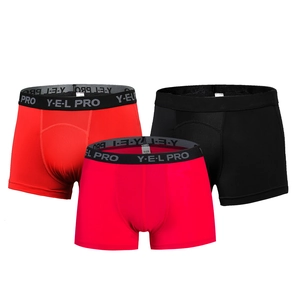 Three-pack of men's athletic boxer briefs in red, black, and magenta breathable fabric