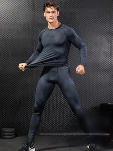 Detail of 3D honeycomb print on grey quick-dry long sleeve gym compression set