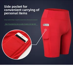 Detail showing the right-side functional pocket on high-waist red yoga shorts