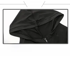 Close-up of black hoodie with high collar, durable metal zipper, and knit fabric detail