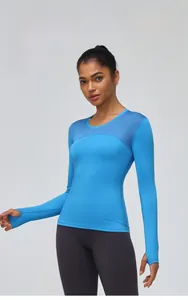 Detail of women's athletic long sleeve shirt featuring thumbholes and breathable mesh panels