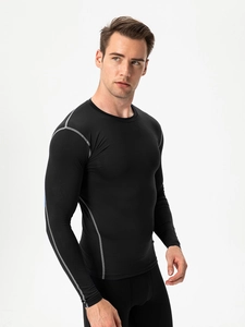 Men's black compression long sleeve shirt with grey flatlock seams for gym and running