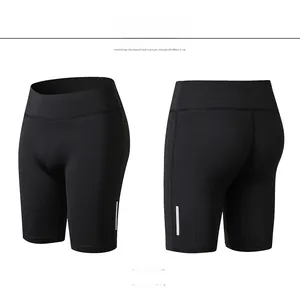 Detail view of high waist black yoga shorts with reflective stripes for fitness and running