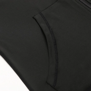 Close-up of side pocket stitching and smooth fabric on women's thermal yoga hoodie