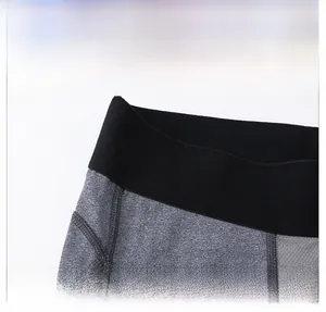 Detail of men's PRO sports pants featuring an elastic waistband and reinforced stitching