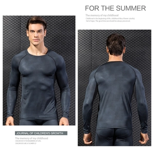 Close-up of men's compression long sleeve top featuring dark grey 3D honeycomb textures