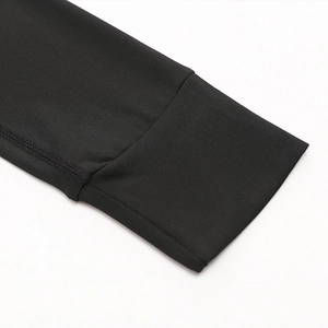 Close-up of premium black elastic knit fabric stitching on a winter yoga sports hoodie