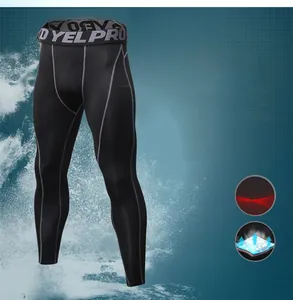 Breathable compression pants for men with grey stitching and elastic performance fabric