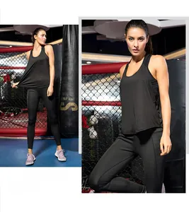 Detail showing women's black sports tank top with asymmetrical irregular hem design
