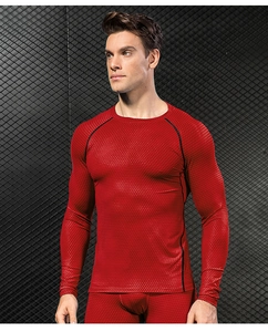 Close-up of red 3D diamond texture compression shirt showing Raglan sleeves and stitching