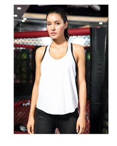 Close-up of white women's quick-dry sports vest with racerback design in gym