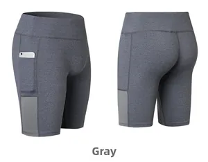 Detail of grey high-waisted yoga shorts with side pocket and breathable mesh panels