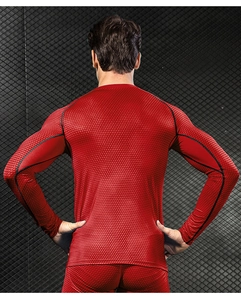 Detail of red 3D textured fabric on men's compression shirt for athletic training
