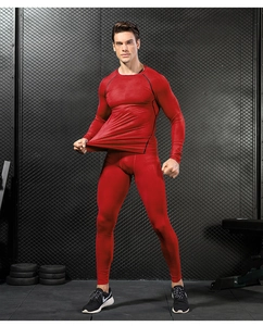 Close-up of red 3D printed compression shirt showing honeycomb texture and flatlock seams