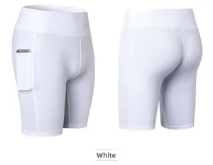 Detail of white high-waisted yoga shorts with side pockets and breathable mesh panels