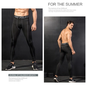 Detail of men's compression pants showing grey stitching and elastic branded waistband