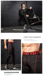 Detail of compression sports pants with red stitching and logo waistband on a male athlete