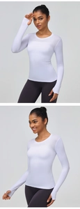 Close-up of women's white fitness top with mesh panels and thumbhole cuff details