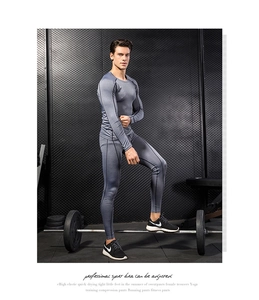 Detail of dark gray men's pro compression set with ergonomic seams and quick-dry fabric