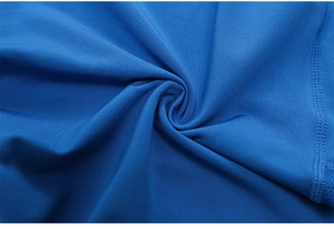 Close-up of blue elastic yoga shorts fabric texture with professional stitching detail