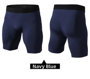 Dettaglio dei pantaloncini a compressione blu navy da uomo con elastico in vita e cuciture