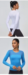 Detail view of mesh patchwork back and thumb holes on long sleeve fitness shirt